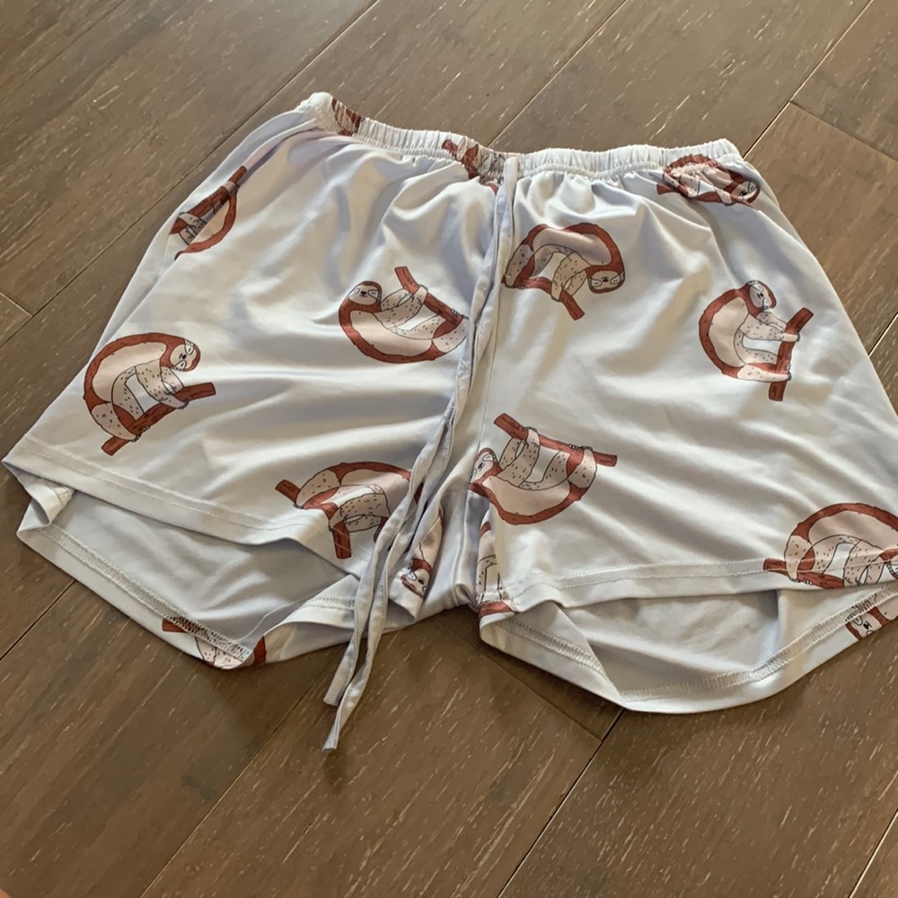 lightly worn pajama shorts with sloth pattern